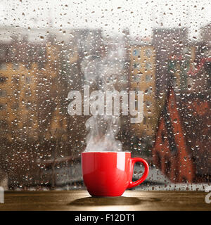 Steaming Coffee Cup On A Rainy Day Window Background Stock Photo Alamy