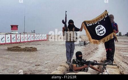Islamic State of Iraq and the Levant propaganda photo showing masked ...