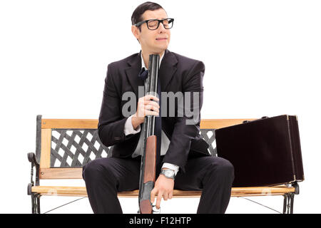 Desperate businessman ready to commit suicide isolated on white Stock Photo