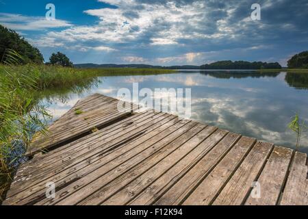 Beautiful lake with old destroyed jetty. Lake near Olszty in Poland, Mazury lake district Stock Photo