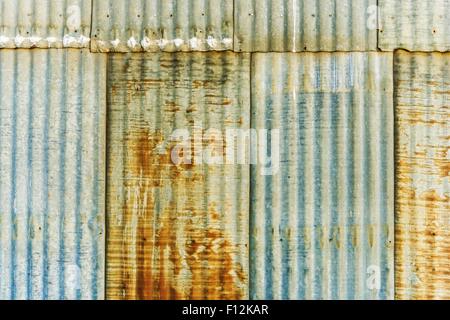 Aged Rusty Corrugated Metal Panels Photo Background. Stock Photo