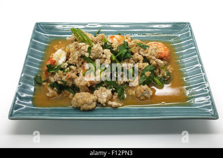 Shrimps and mince pork stir fried with fresh herbs Stock Photo