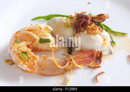 Fresh raw oyster and shrimp with spicy sauce, thai style seafood Stock Photo