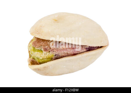 Close-up of a pistachio seed with shell isolated on white background. Stock Photo