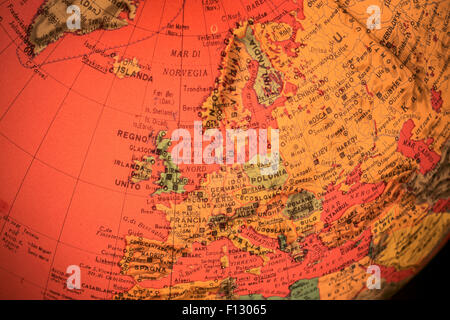 MILAN, ITALY - DECEMBER 17, 2014: red light world globe illuminated from within with closeup on Europe Stock Photo