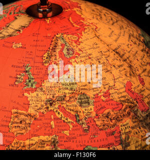 MILAN, ITALY - DECEMBER 17, 2014: red light world globe illuminated from within with closeup on Europe Stock Photo