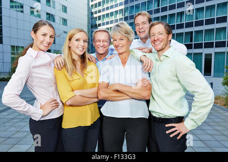 Happy employees and smiling staff members as a successful business team Stock Photo