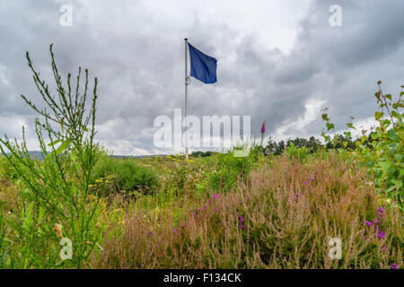 Flag indicating frontline of the Jacobite army on moorland at Culloden Moor former battlefield in Highland, Scotland Stock Photo