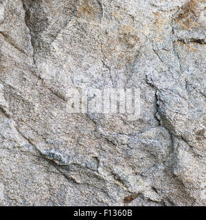 Untreated natural granite background texture wall. Closeup. Stock Photo