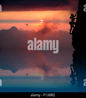 Female rock climber and mountain sunset Stock Photo