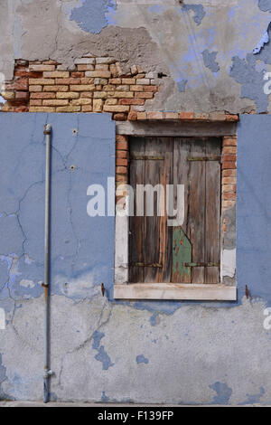 Weathered house facade and window Stock Photo