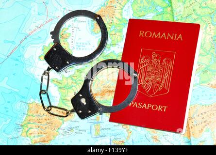 Romanian passport with currency on Europe map Stock Photo