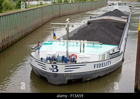 Barge transporting  pulversied coal on Mosel River Germany Stock Photo