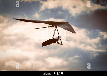 Hang glider at sunset Stock Photo