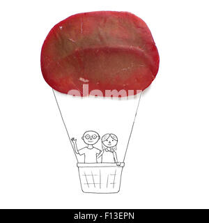 Conceptual couple in a hot air balloon Stock Photo