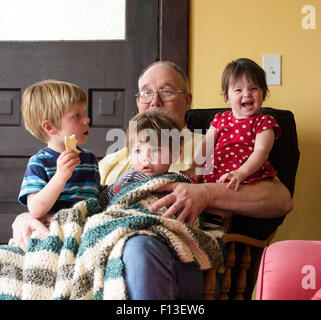 girl sitting on boy's lap Stock Photo - Alamy