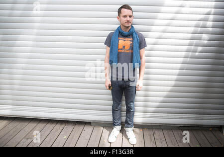 Berlin, Germany. 26th Aug, 2015. US actor Elijah Wood poses on the grounds of Club Berghain during the festival 'Pop-Kultur' in Berlin, Germany, 26 August 2015. The festival will run from 26 to 28 August 2015 at Club Berghain. Wood will perform as a disc jockey during the festival. Photo: JOERG CARSTENSEN/dpa/Alamy Live News Stock Photo