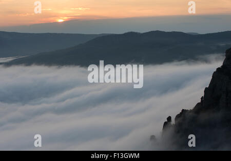 Mountain Landscape in Strong Fog at Sunset Stock Photo