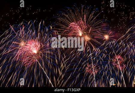 Brightly Colorful Fireworks in the Night Sky Stock Photo
