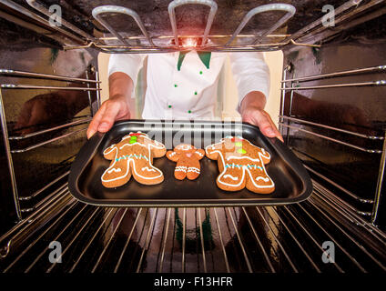 Baking Gingerbread man in the oven, view from the inside of the oven. Cooking in the oven.