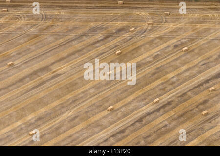 Bales of hay in a field in Oxfordshire UK viewed from the air in a hot air balloon Stock Photo