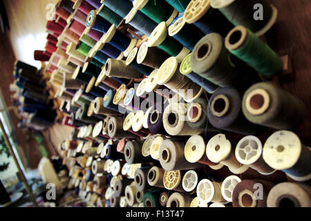 Sewing threads multicolored background closeup Stock Photo