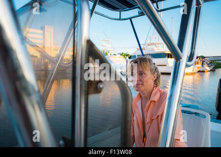Woman operating boat, Marina in Nuevo Vallarta, Mexico Stock Photo