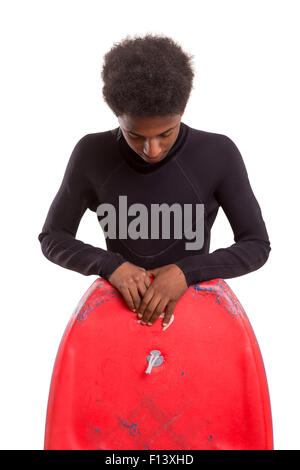 A young black bodyboarder posing in studio Stock Photo