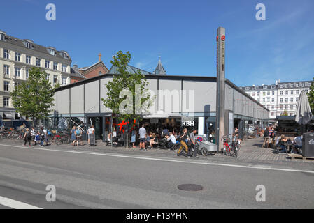 Torvehallerne, the covered food market at Israels Plads in Copenhagen on a sunny  summer Saturday morning. Sunshades down. Stock Photo