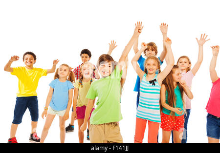 Boys and girls very happy raising hands Stock Photo