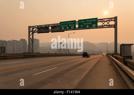 Afternoon Haze and air pollution on Ross Island Bridge with freeway signage in Portland Oregon due to forest wildfires Stock Photo