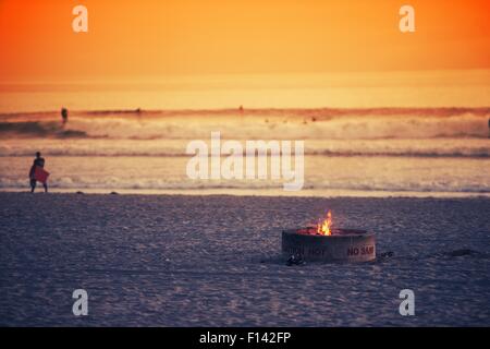 Beach Fire Pit. Oceanside, California Burning Fire Pit on the Beach. Stock Photo