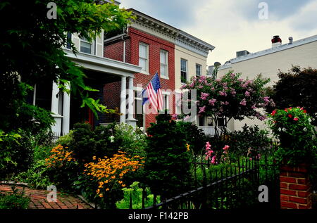 Baltimore, Maryland  Handsome homes with colourful gardens on Montgomery Street in the Federal Hill historic district Stock Photo