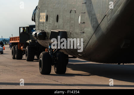 Moscow, Russia, Wednesday, August 26, 2015. The Twelfth International Moscow Aerospace Show MAKS 2015 was opened in Zhukovsky city in the Moscow Region on August 25, 2015. The aim of the show is to demonstrate Russian aerospace achievements, make contracts and negotiate international projects. Mil Mi-26 transport helicopter is towed back to the exposition place after a demonstration flight. Credit:  Alex's pictures/Alamy Live News Stock Photo