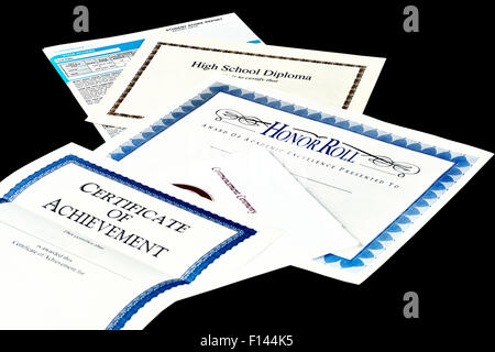 Education documents including SAT report, high school diploma, honor roll recognition, commencemnent program and certificate of  Stock Photo