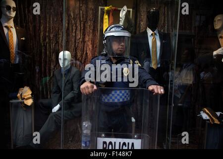 Mexico City, Mexico. 26th Aug, 2015. A police guards during the march for the eleven months of the disappearance of the 43 students of the Normal Rural School 'Raul Isidro Burgos' of Ayotzinapa, state of Guerrero, held in Mexico City, capital of Mexico, on Aug. 26, 2015. Relatives of the 43 missing students of Ayotzinapa took part in a march on Wednesday, one month before the first anniversary of their disappearance. Credit:  Alejandro Ayala/Xinhua/Alamy Live News Stock Photo