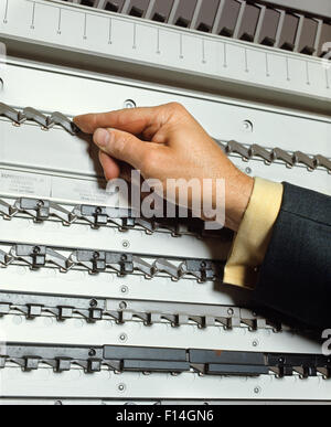 1970s VOTING MACHINE ANONYMOUS HAND PRESSING SWITCH MAKING SELECTION Stock Photo