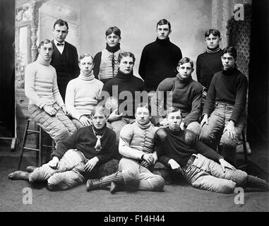1900s 1903 GROUP PORTRAIT HIGH SCHOOL FOOTBALL TEAM PLAYERS WEARING TEAM UNIFORMS POSED LOOKING AT CAMERA Stock Photo