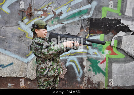 boy teenager in camouflage and with equipment for paintball Stock Photo