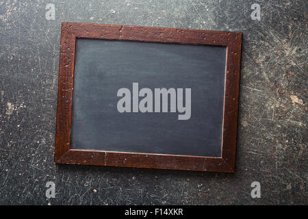 vintage chalkboard on old work table Stock Photo