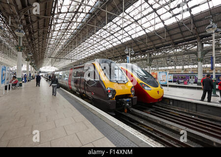 cross country and virgin pendolino trains at Piccadilly train station Manchester UK