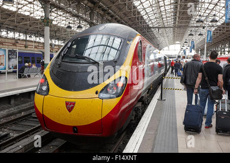 virgin trains pendolino train at platform in Piccadilly train station Manchester UK Stock Photo