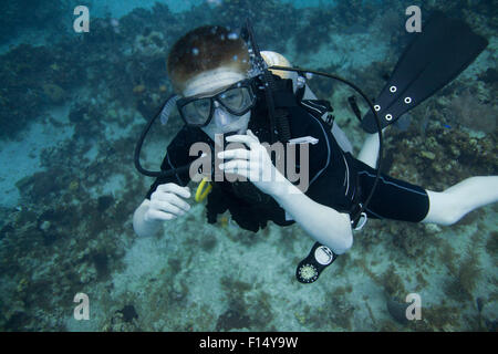 Boy scuba diving underwater Stock Photo
