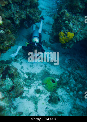 Boy scuba diving underwater Stock Photo