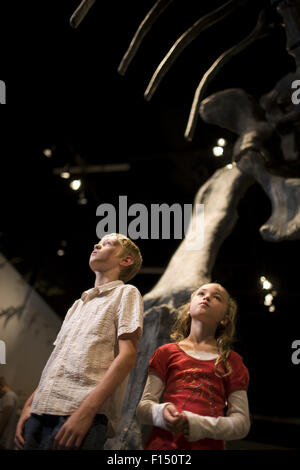 USA, Utah, Lehi, children (8-11) in museum of dinosaurs Stock Photo