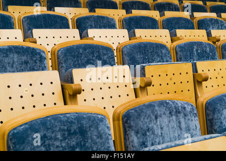 Rows of empty blue seats Stock Photo