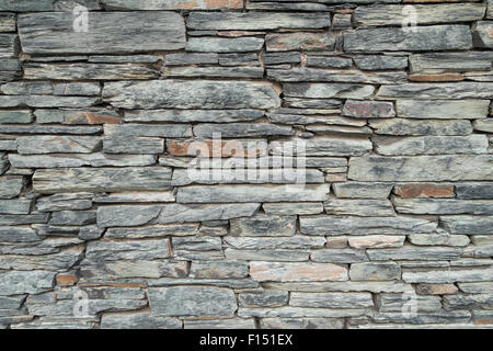 Background texture of a decorative slate stone wall. Stock Photo