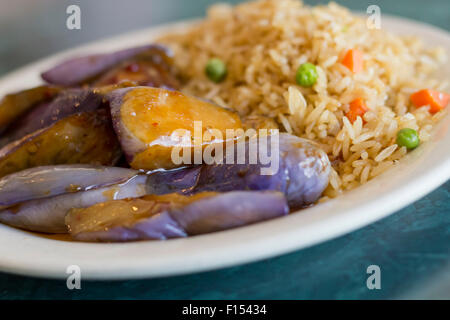 Chinese sauteed eggplant with oyster sauce and fried rice Stock Photo