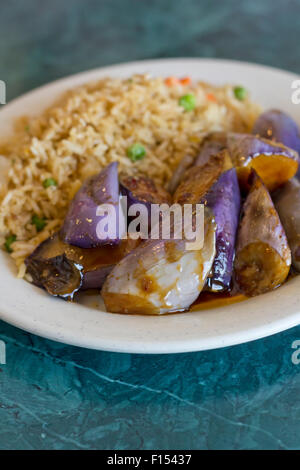 Chinese sauteed eggplant with oyster sauce and fried rice Stock Photo