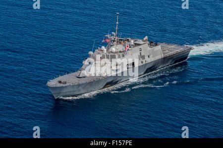 The U.S. Navy littoral combat ship USS Fort Worth assembles in formation with the Royal Malaysian Navy as part of CART Malaysia training exercises August 19, 2015 in the Sulu Sea. Stock Photo
